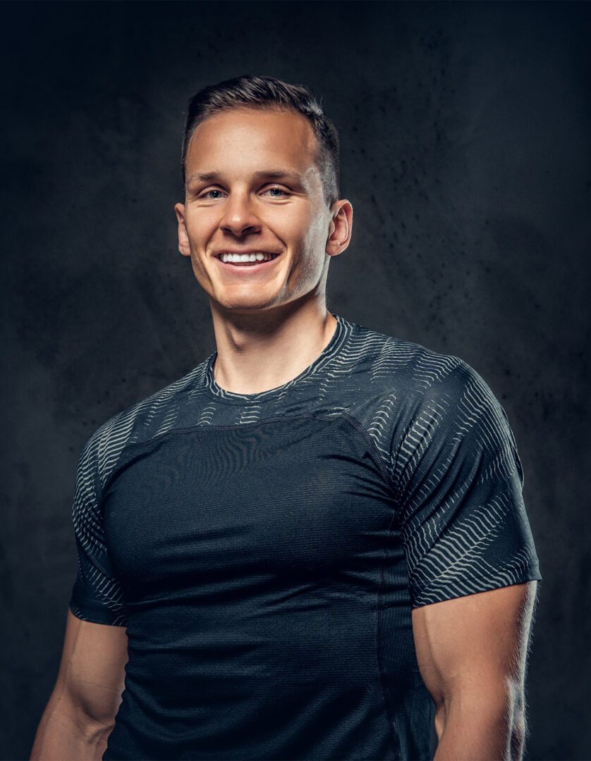 Smiling athletic man - GettyImages-1072200596