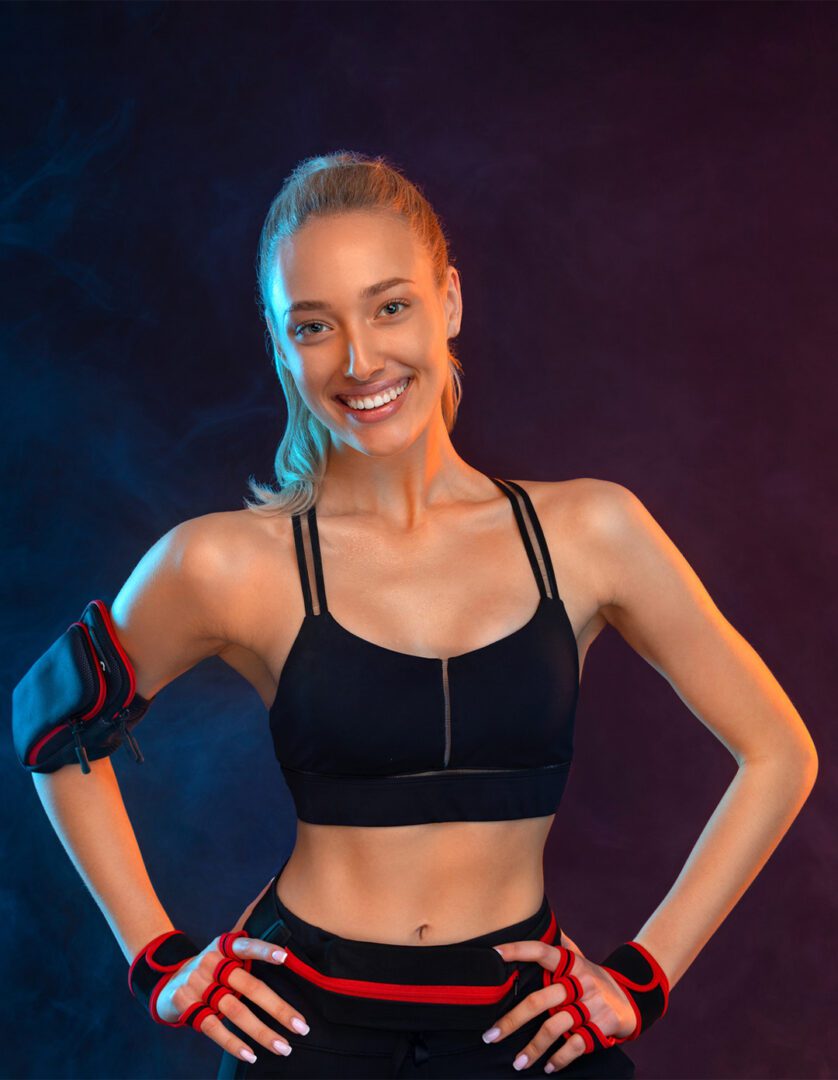 Smiling athletic woman - GettyImages-1852196165